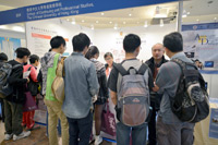 Students and parents gather at the CUSCS booth for programme information